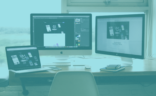 laptop and two screens